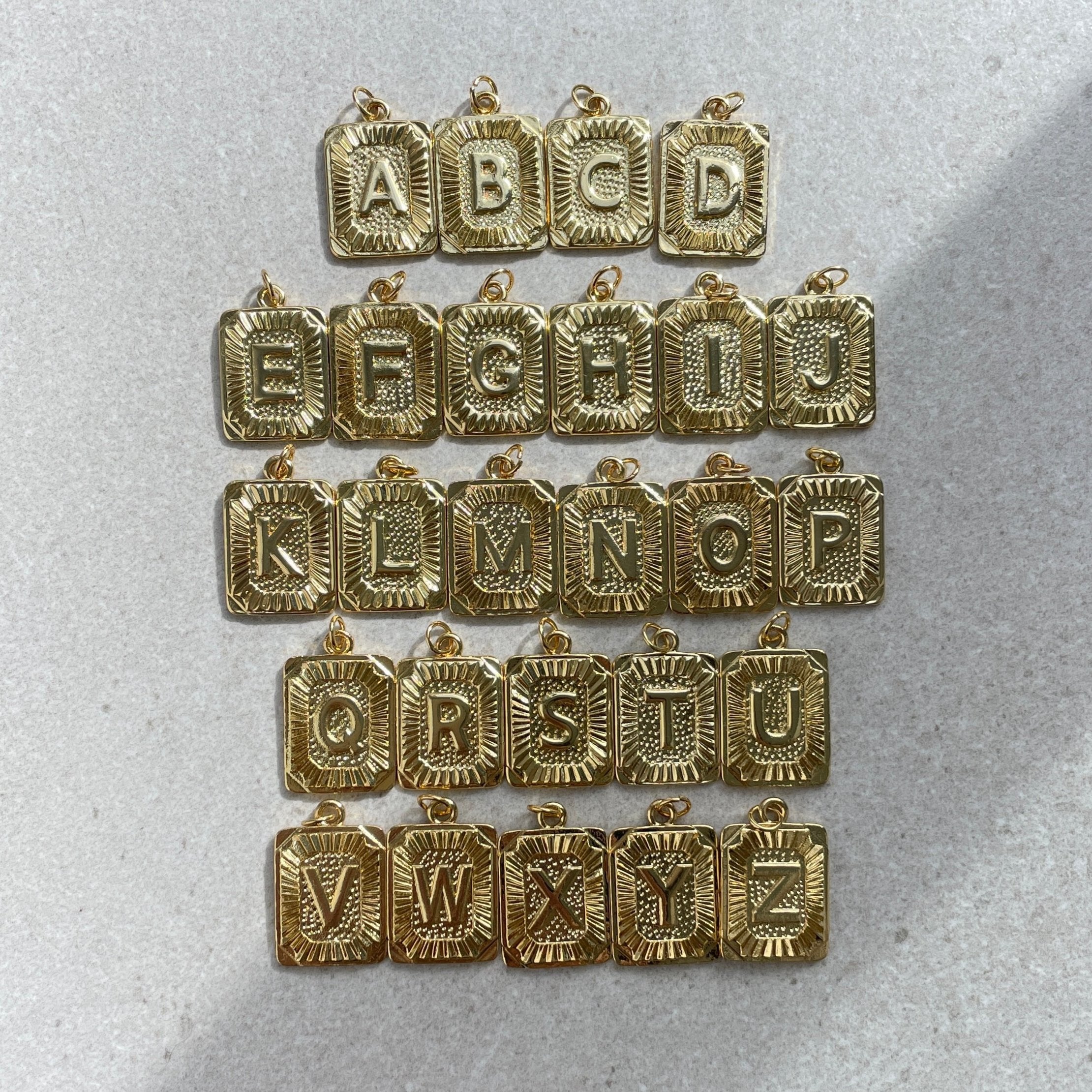 Metal letter charms top
